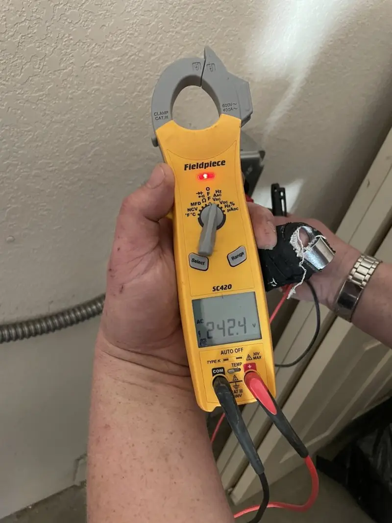 Voltage testing with clamp meter during Outlet Installation in Eastham